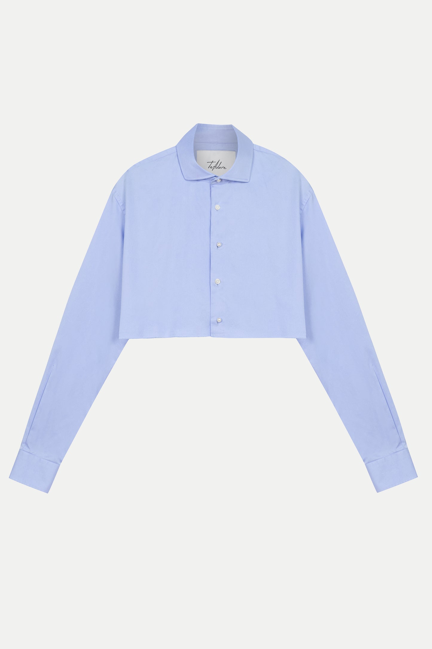 Luxury designer women’s blue cotton shirt – front view of Tina cropped top with pearl buttons